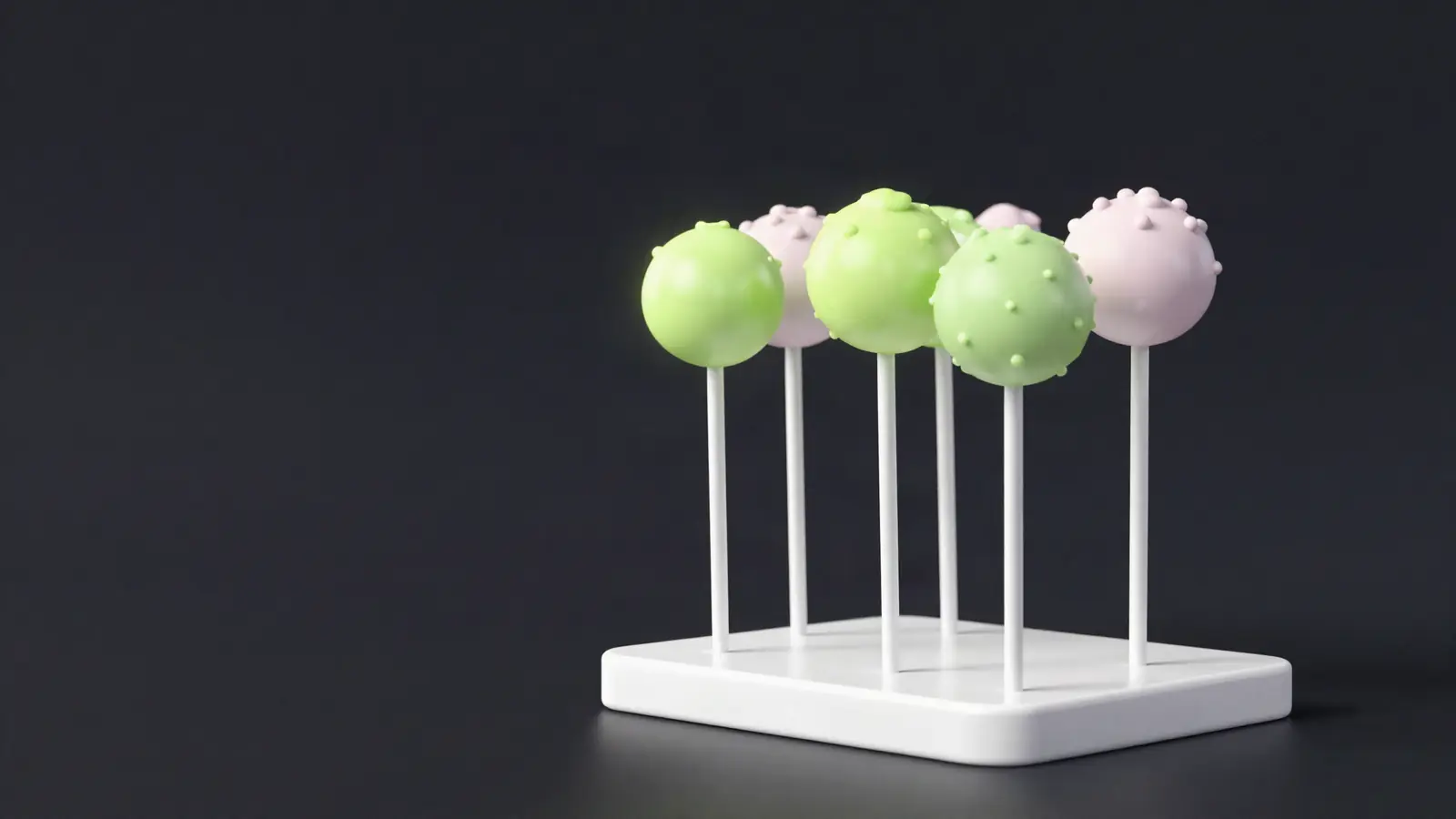 Cake pops on sticks in a white display stand